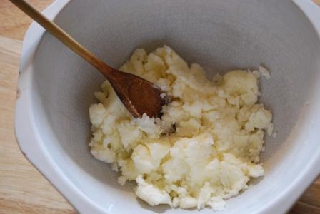 white bowl with butter and shortening mixed together with a brown wooden spoon sitting in&hellip;